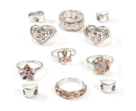 A collection of Clogau silver and Welsh rose gold rings and charms. The seven hallmarked silver and Welsh rose gold rings to 