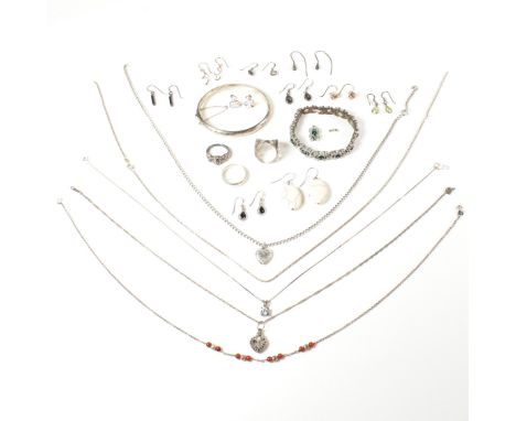 A large collection of silver and white metal gem set jewellery.&nbsp;The lot to include three marked silver rings including g
