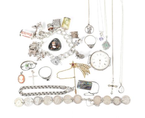 A vintage silver charm bracelet and collection of silver jewellery. The bracelet having a heart padlock clasp strung with sil
