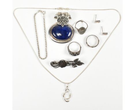 A collection of silver and white metal jewellery. The Jewellery to include a large laps lazuli set pendant stamped 925, celti
