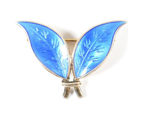 A David Andersen silver and enamel leaf brooch pin. The Norwegian sterling silver brooch pin in the form of two leaves set wi