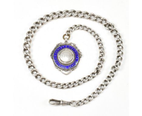 A silver curb link Albert chain with shield fob. The silver and enamel Henley &amp; District Football League shield fob havin