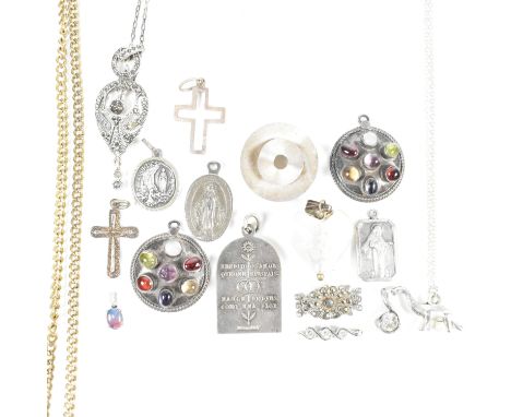 A collection of silver and white metal necklaces and necklace pendants. The jewellery to include a silver dinosaur pendant ne