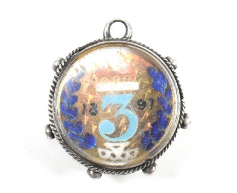 A mounted 1897 three shilling coin with enamel decoration. The 1897 three shilling coin having enamel decoration to obverse t