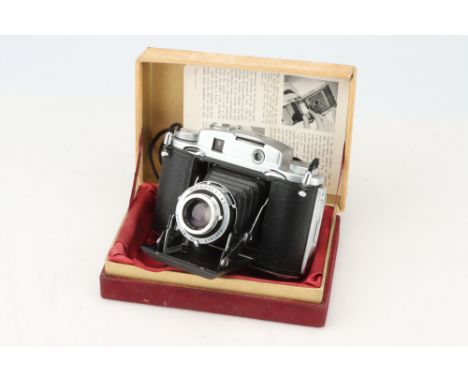 A Ross Ensign 12-20 Rangefinder Camera, chrome, body VG-E, shutter working, with Ross Xpres 75mm f/3.5 lens, optics G, some h