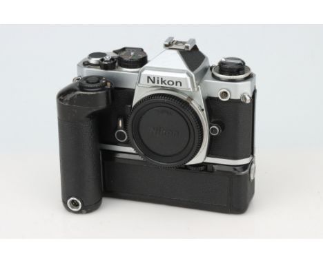 A Nikon FE SLR Camera, chrome, body, G, shutter working on M90, complete with other NIkon accessories including MD-11, MD-4, 