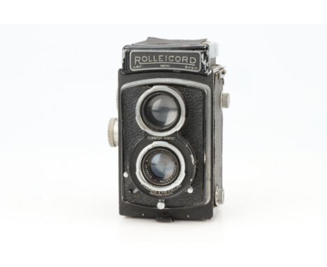 A Rollei Rolleicord Medium Format TLR Camera, black, body G, shutter working but sticks on slow speeds, viewfinder housing da