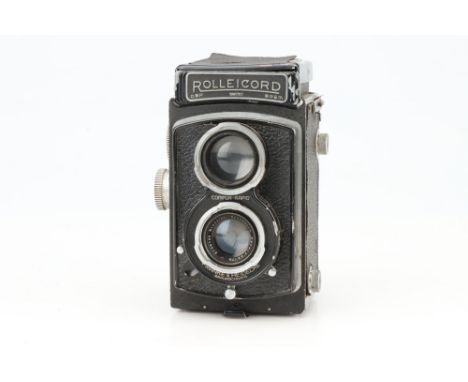 A Rollei Rolleicord Medium Format TLR Camera, black, body G, shutter working but sticks on slow speeds, viewfinder housing da