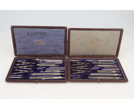 Three Sets of Drawing Instruments, [CITES] a set by Army &amp; Navy Ltd, c.1900 with ivory parallel rule and protractor/scale