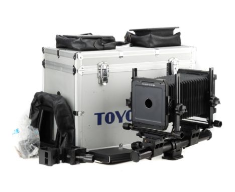 A Toyo View C Monorail Large Format Camera, complete with spare lens boards, bag bellows and Polaroid back, in Toyo fitted ca