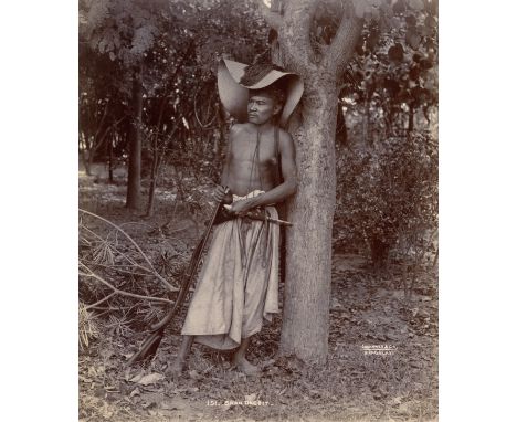 JOHANNES &amp; Co, Photograph of a Burmese Bandit, toned glossy gelatin silver print, c.1890, titled '151 Shan Dacoit' and si