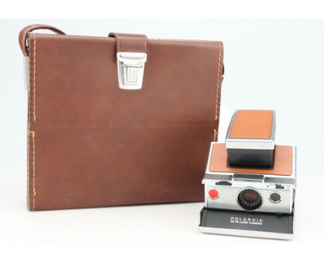 A Polaroid SX-70 Land Camera Outfit, brown &amp; chrome, body G-VG, some slight wear to leather, together with a maker's hard