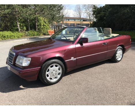 A 1996 Mercedes-Benz E220 Sportline convertible, registration number 823 FDM, Red. Introduced to the market in 1985, with the