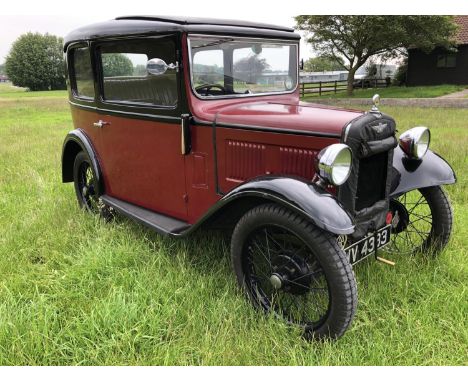 A 1933 Austin 7 box saloon, registration number WV 4333, chassis number B8-8397, engine number 184791, maroon over black. Thi