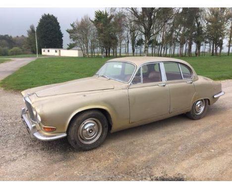 A 1968 Jaguar 420, registration number KNC 911F, golden sand. The 420 was the last of the compact saloons before the introduc