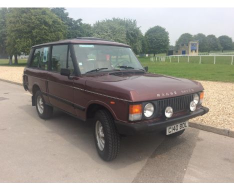 A 1986 left hand drive Range Rover Classic two door, registration number C140 BDL, Burgundy Calypso red, chassis number SALLH