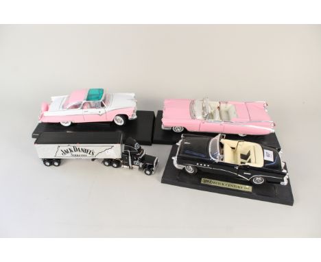 Three boxed 1/18th American car models, Buick, Cadillac and Ford plus a model Jack Daniels truck