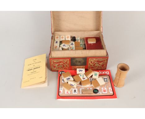 A vintage boxed Mahjong set in wooden red lacquered box with instructions