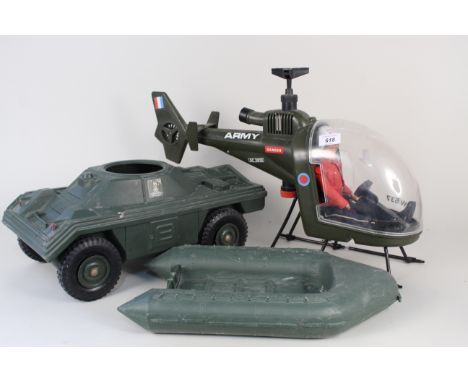 An Action Man toy helicopter with figure, boat and armoured car