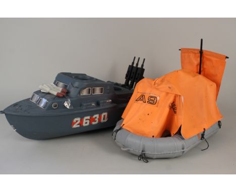 An Action Man toy raft and attack boat