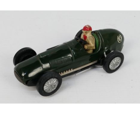 Scalextric - Tinplate - An unboxed 1950s tinplate Ferrari 4.5L model in green. # C52. It shows some signs of age and wear and
