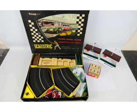 Scalextric - A boxed vintage Scalextric set # C.M.3. The set has no cars in it but does have a number of track supports, 2 x 
