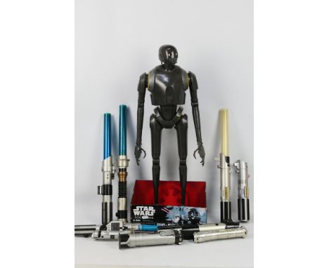 Star Wars - Hasbro - Disney. A selection of Nine loose light sabers and One carded large figure appearing in Playworn to Exce