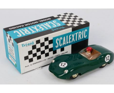 Scalextric - A boxed Lister Jaguar racing car in green # MM/C.56. The model appears in Very Good condition with light signs o