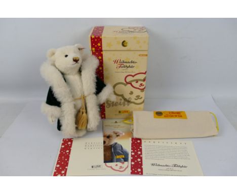 Steiff musical Christmas Teddy Bear - A boxed and bagged limited edition Steiff musical Christmas Teddy Bear. In white alpaca