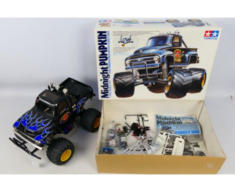 Tamiya - A built 1:12 scale 53 Ford F100 custom pickup truck 'Midnight Pumpkin' # 58070. The model has been used but still re