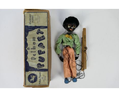 Pelham - A boxed Pelham Puppet Type SS Golly. The puppet appears in Good condition with little wear but needs some string wor