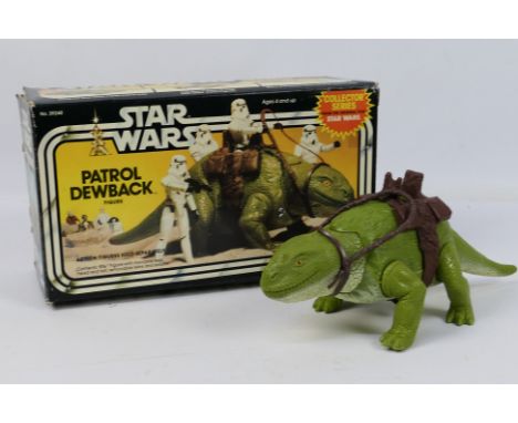 Kenner - Star Wars - A boxed Patrol Dewback figure # 39240. The model appears Mint on its original inner packing piece. In a 