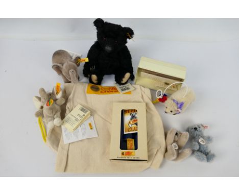 Steiff - A collection of 6 small Steiff bears: 1 x black bear with gold button and yellow tag 660498, approx 19 cm (l), 1 x "