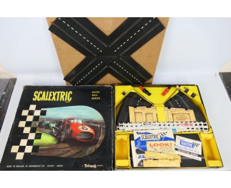 Scalextric - A boxed vintage Scalextric set # G.P.3. The set does not contain any cars but does have trackside accessories an