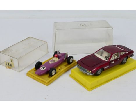 Dinky - Mini Mite - 2 x cased cars, Dinky Monteverdi 375L # 190 and a plastic BRM F1 car # 813. They both appear in Very Good