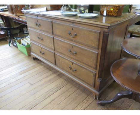 A George III oak and mahogany crossbanded Lancashire mule chest, the hinged top over four short dummy drawers and two short d