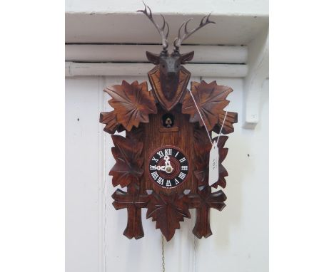 A modern cuckoo clock, 31cm high