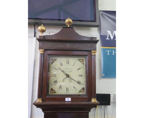 An early 19th century oak longcase clock, with gilded finials over blind fret carved frieze, the shell painted dial, with dat