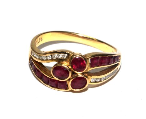 A ruby and diamond ring set in 18 carat gold 