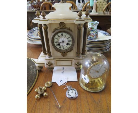 A late Victorian alabaster mantel clock, with French movement striking on a gong, 37 cm high, a brass anniversary clock, as f