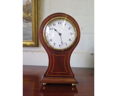 An Edwardian balloon shape table clock timepiece, the enamel dial within a mahogany and boxwood strung case, Swiss single tra