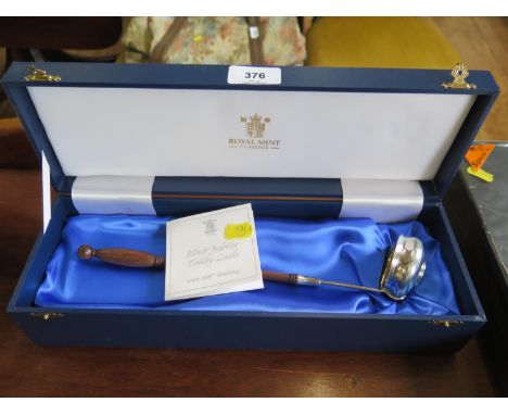 A Royal Mint limited edition silver Toddy Ladle for the Golden Jubilee 2002, inset with an 1887 Shilling, cased 
