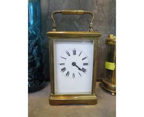 A brass cased carriage clock, of conventional form, with enamel dial (cracked), the twin train movement striking on a gong, 1