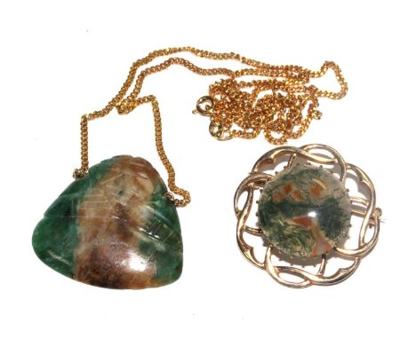 A 9 carat gold set brooch with a polished jade, together with a jade pendant on a 9 carat chain (2) 