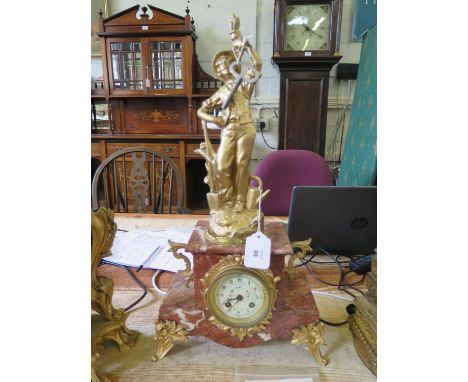 A late Victorian gilt spelter and pink marble mantel clock, the figure of a gardener (after Ruchot) over a stepped case and f