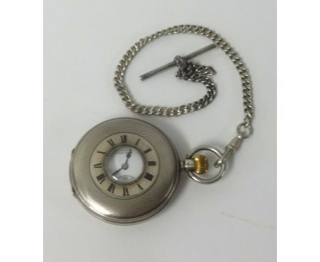 Zenith, silver pocket watch, half hunter with engined dial, with a guard chain.
