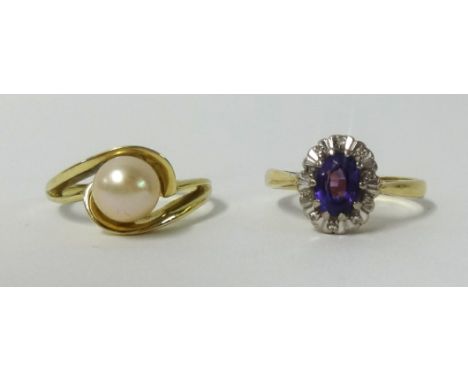 Two dress rings, an 18ct amethyst and diamond cluster ring and a single pearl ring, stamped 585 (2).