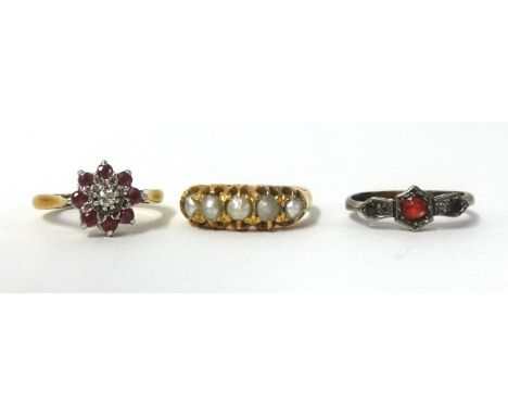 A 18ct five stone pearl ring, a 18ct diamond and ruby cluster ring and a small 18ct ruby ring (3), gross weight 8.8gms, large