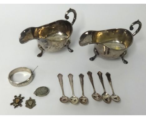 Two bags of various Victorian and later costume jewellery, together with a pair of silver plated sauce boats and a pair of ja