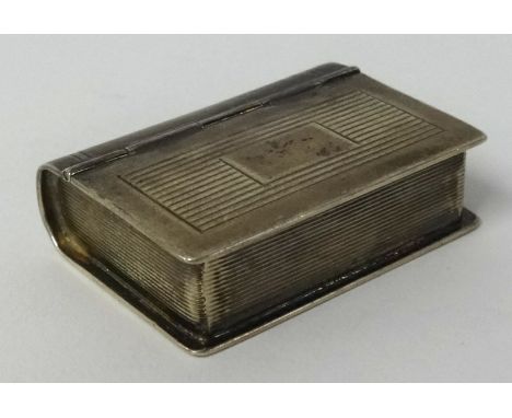 A 20th century silver and gilt lined snuff box in the form of a book, maker 'H.U', approx. 40mm long.